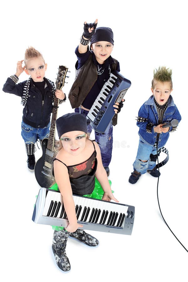 Group of children singing in heavy metal style. Shot in a studio. Isolated over white background. Group of children singing in heavy metal style. Shot in a studio. Isolated over white background.