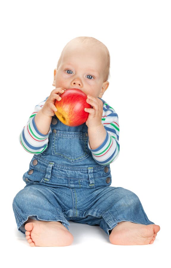 Kleines Baby, das einen Apfel isst lizenzfreie stockbilder Kleines Baby, das einen Apfel isst lizenzfreie stockbilder