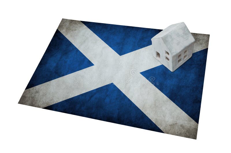 Kleines Haus auf einer Flagge - Schottland lizenzfreies stockfoto Kleines Haus auf einer Flagge - Schottland lizenzfreies stockfoto