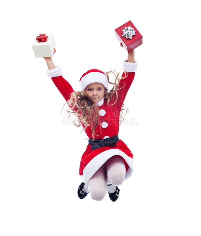 Kleines Weihnachtsmann-Mädchen, das hoch mit Geschenken springt stockfoto Kleines Weihnachtsmann-Mädchen, das hoch mit Geschenken springt stockfoto