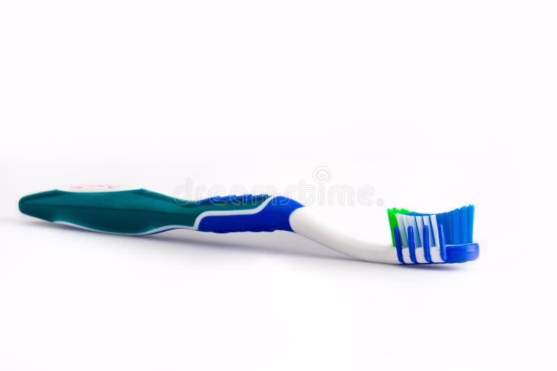 Close up of a toothbrush over white background. Close up of a toothbrush over white background.