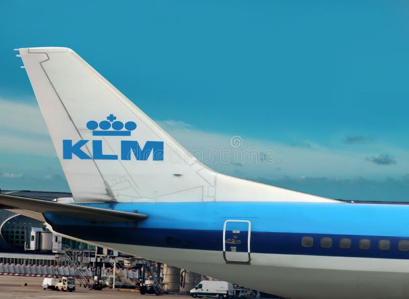 Airplane with the symbol of KLM airline company on the tail is on the airport. The beautiful blue sky area is free for your text. Airplane with the symbol of KLM airline company on the tail is on the airport. The beautiful blue sky area is free for your text.