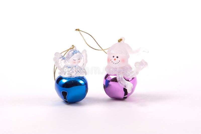 2 Jingle bell Christmas tree ornaments with acrylic figures on the top of the bells, one snowman and one an angel. 2 Jingle bell Christmas tree ornaments with acrylic figures on the top of the bells, one snowman and one an angel.