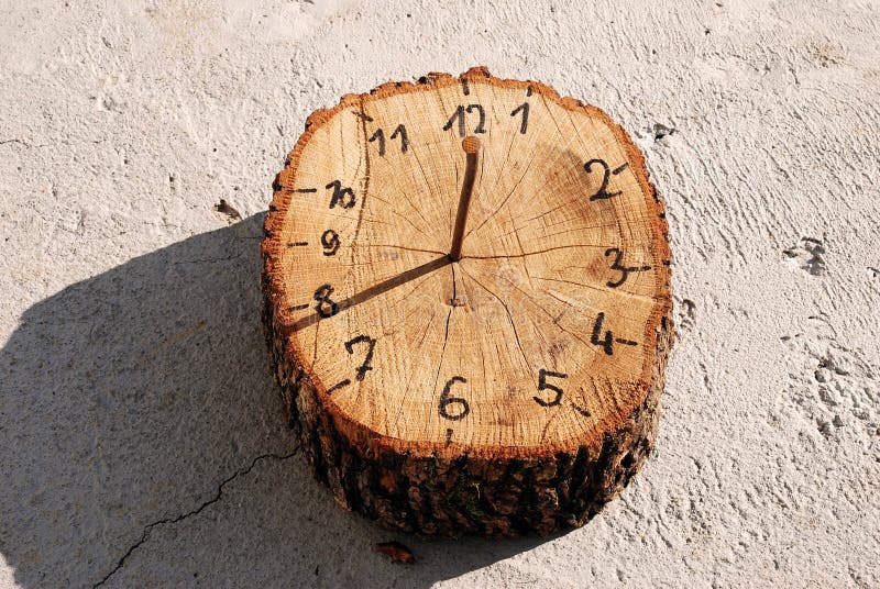 Wooden handmade sun-dial clock 8 o'clock outdoor. Wooden handmade sun-dial clock 8 o'clock outdoor