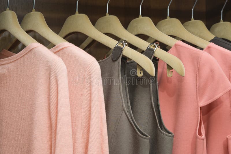Colorful collection of women's clothes hanging on a rack. Colorful collection of women's clothes hanging on a rack