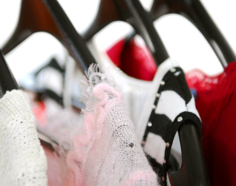 Women's clothing on a rack on black hangers. Women's clothing on a rack on black hangers