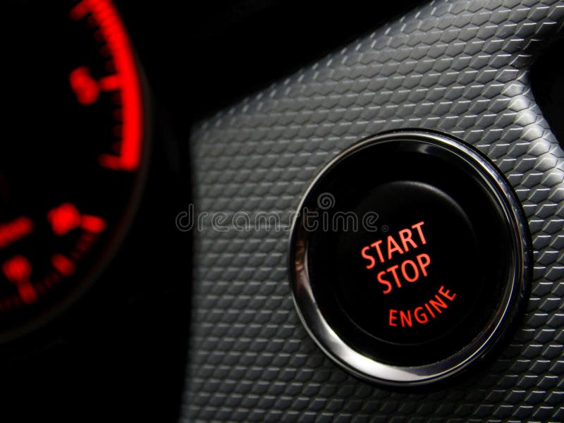 Start Stop engine button in a sport car. Start Stop engine button in a sport car