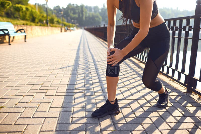Knee Injury in Athlete Girl in the Park. Stock Image Image of