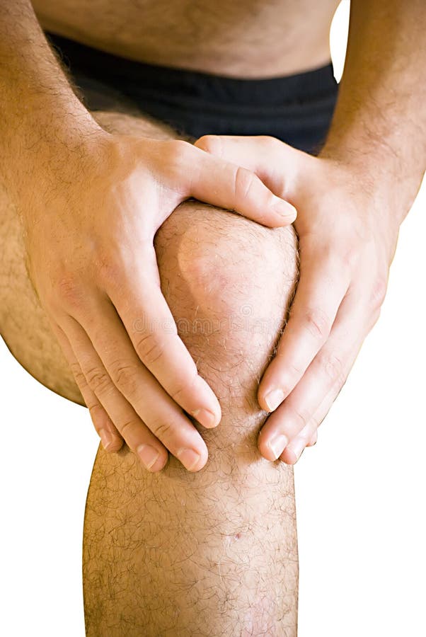 Man having pain in his knee making massage. Man having pain in his knee making massage