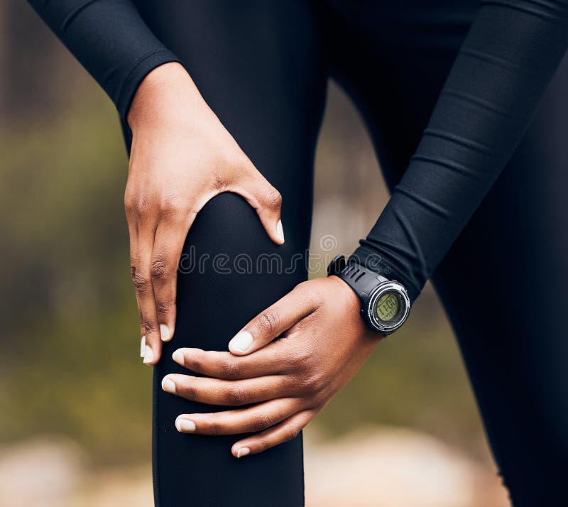 Knee pain, training and running person with medical injury, fitness or sports anatomy problem in forest or nature royalty free stock photo