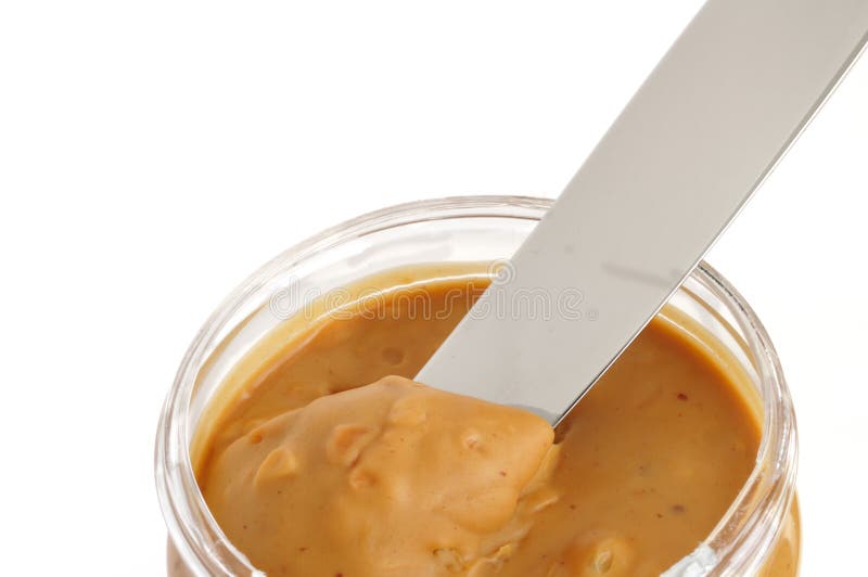 Peanut butter spread on a knife Stock Photo by ©magone 70606559