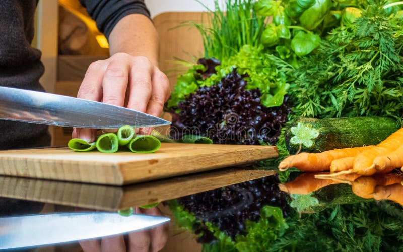 Knife Cutting Vegetables in the Kitchen Stock Image Image of human