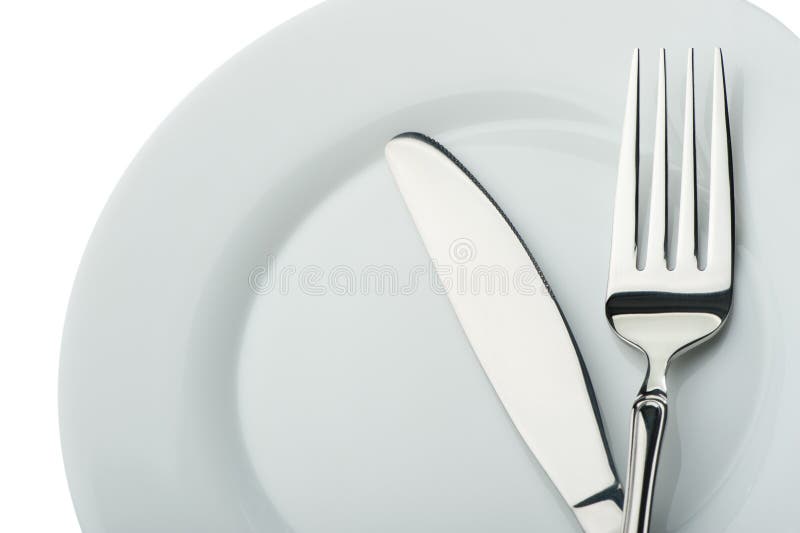 Knife and fork on a plate stock image. Image of luxury 10564135