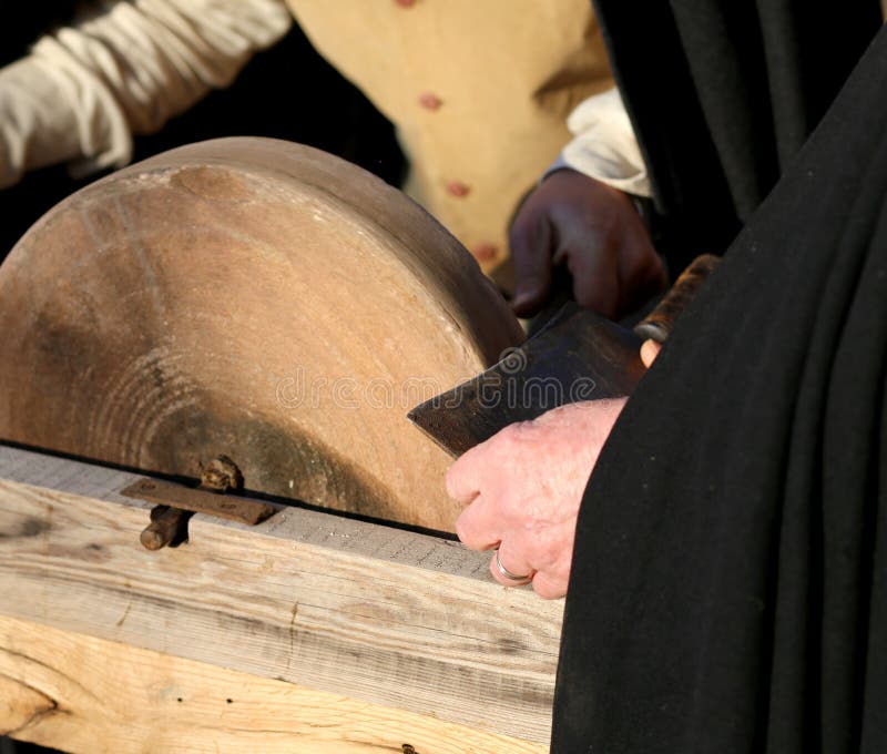 Knife Sharpener Sharpens His Knife on the Grinding Wheel Stock Photo