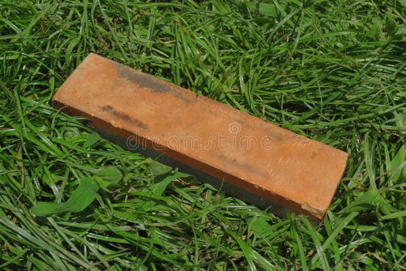 Knife Sharpening Stone on the Grass Stock Photo Image of close