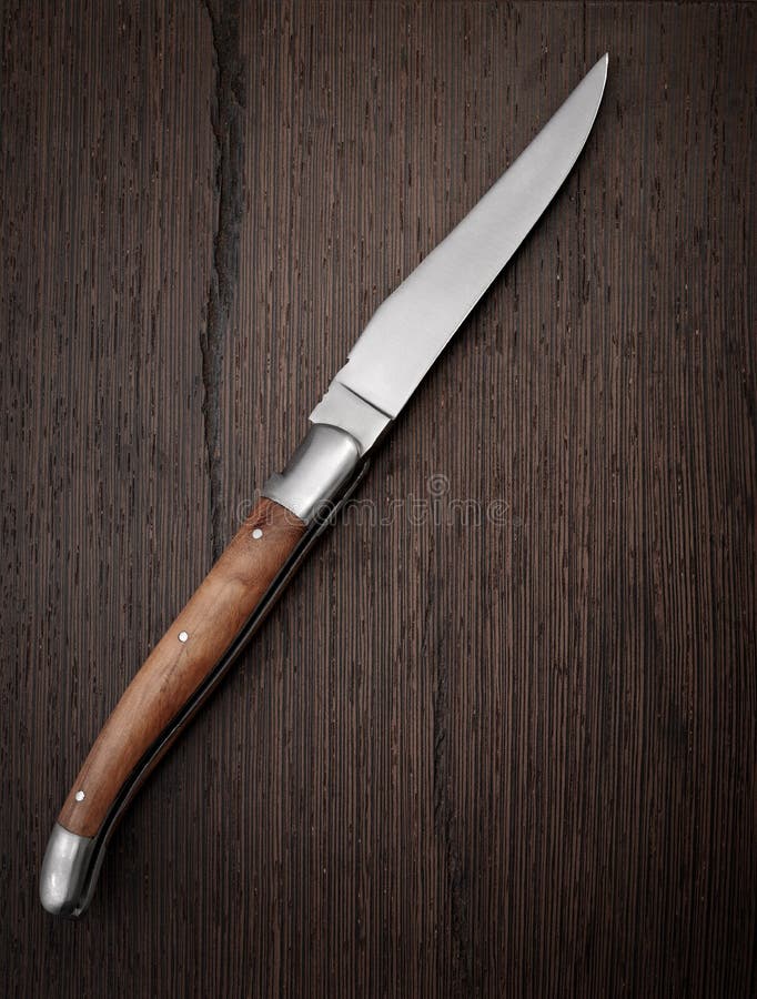 Knife on wooden background stock photo. Image of cutting 22895838