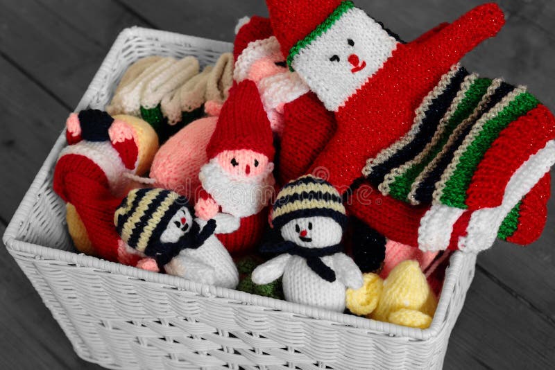 Knitted christmas toys and decorations in a basket