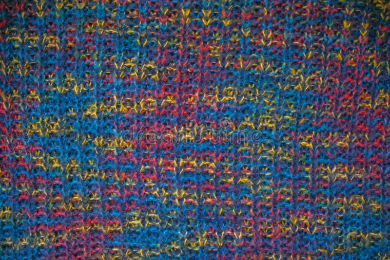 Knitted fabric texture. Closeup view of multicolored fabric jersey. Multicolor abstract background and texture for designers. Colo stock photography