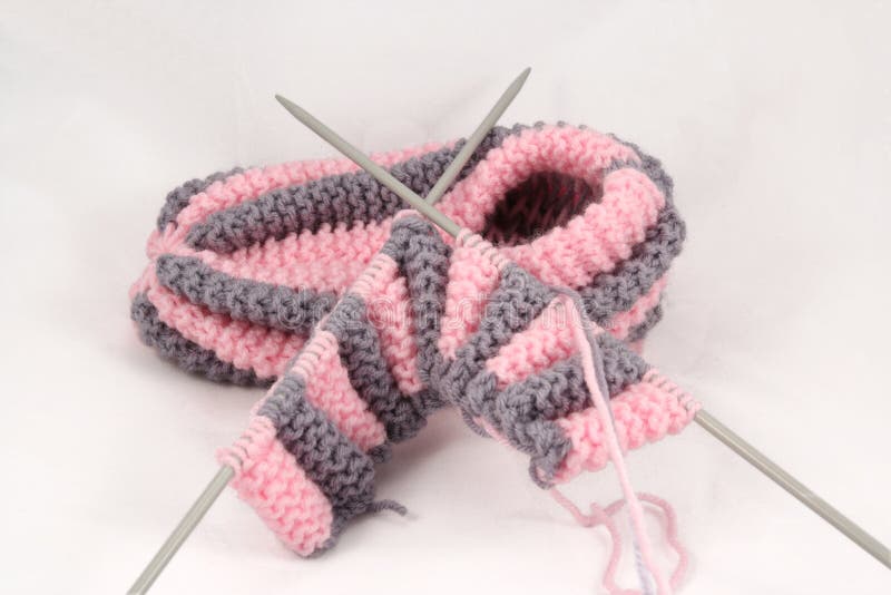 Knitted slipper and knitting-needles