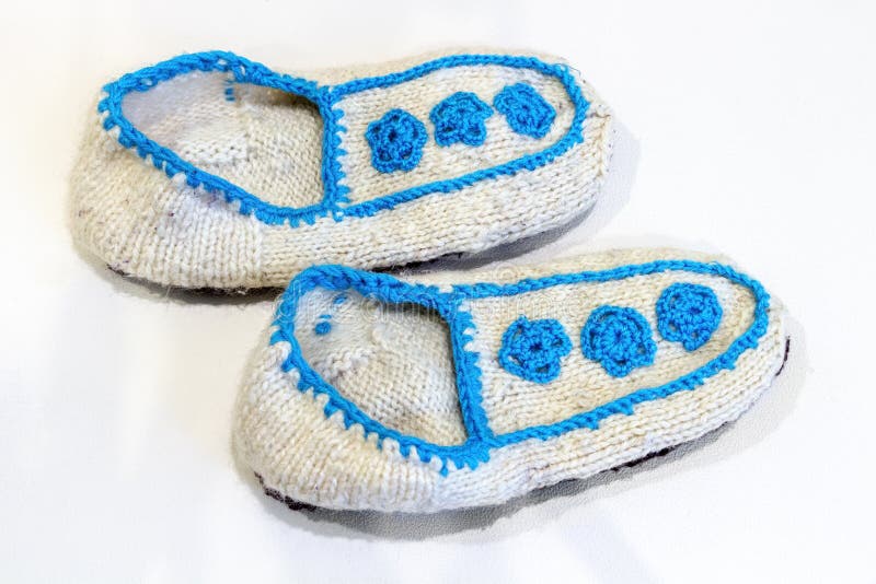 Knitted wool slippers stock photos