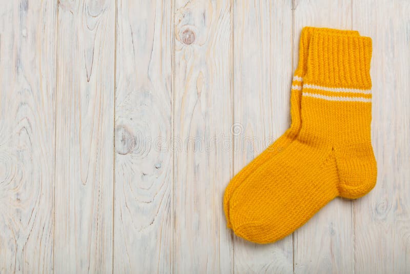 Knitted Woolen Socks Yellow Light on the Wooden Background. Stock Image Image of blue, fashion