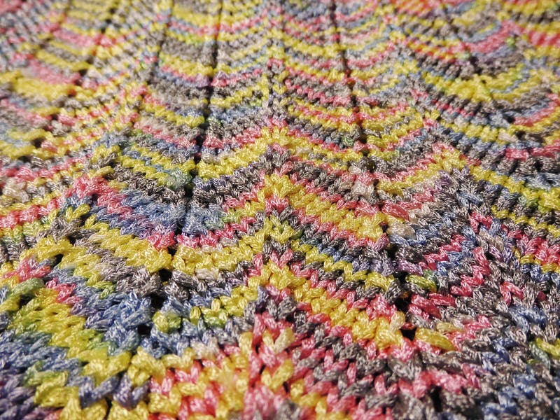 Knitting multicolored texture. Zigzag stock image