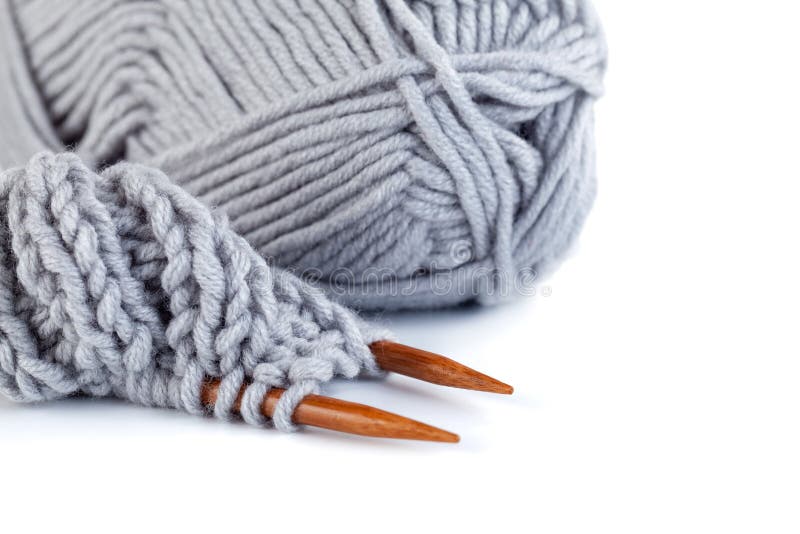 Knitting Needles and Grey and Yellow Woolen Threads Isolated on White