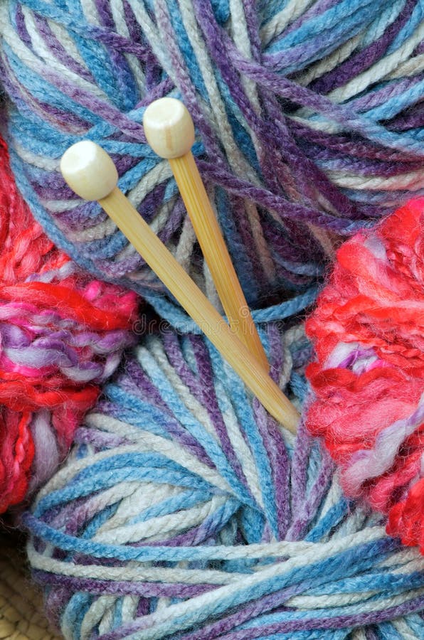 Pretty pink and blue yarn with knitting needles. Pretty pink and blue yarn with knitting needles