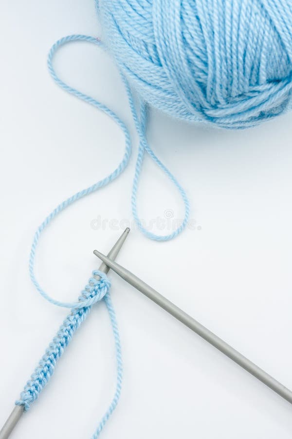 Blue knitting wool and knitting needles