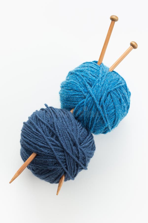 Knitting yarn balls in blue tone and needles