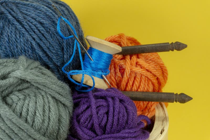 Knitting yarn balls and needles in basket stock photos Knitting yarn balls and needles in basket stock photos
