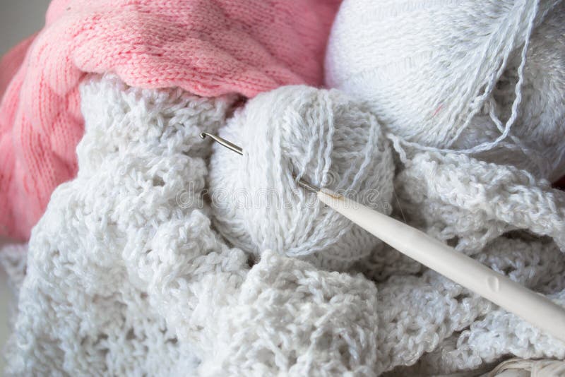 Knitting yarn balls and needles on the white wooden background. stock photography Knitting yarn balls and needles on the white wooden background. stock photography