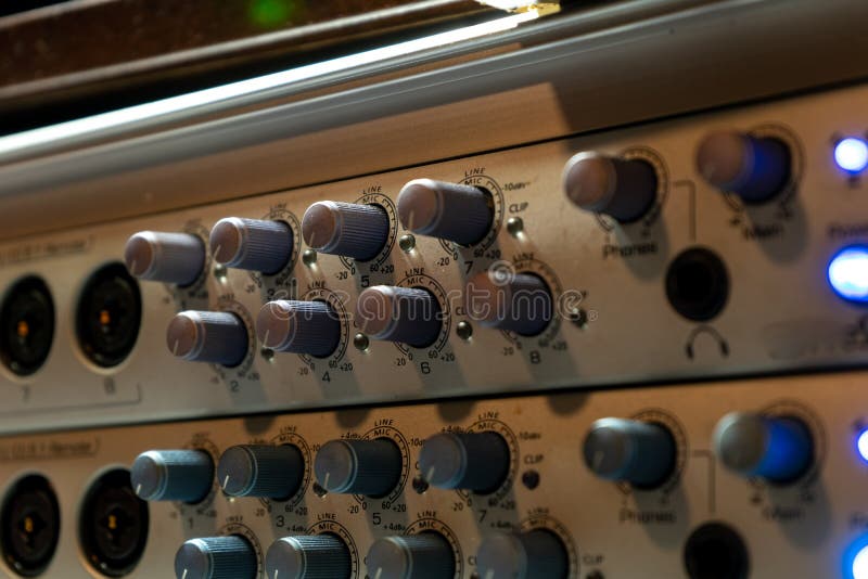 Gain or volume increase or decrease knobs on an audio interface with blue indicator lights. Board decrease stock images, royalty-free photos and pictures