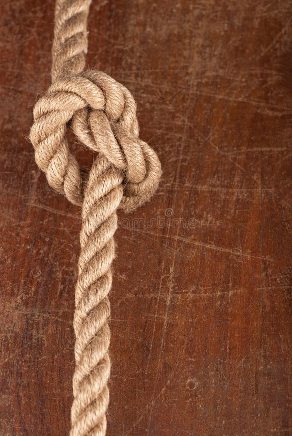 Knot on Wood. Rope with Reef Knot on Wood Texture Background Stock