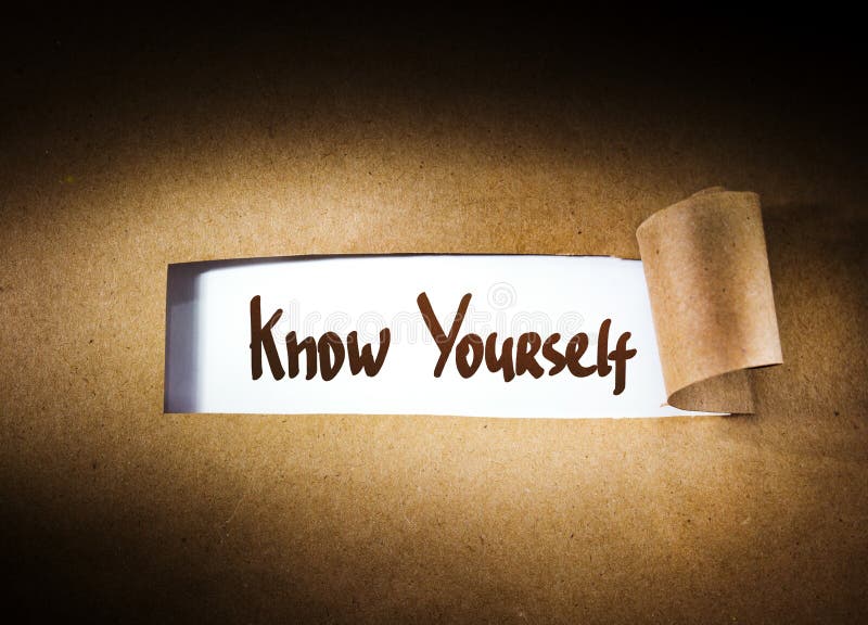 Know yourself appearing behind torn paper royalty free stock photos