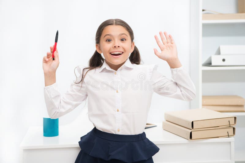 She knows right answer. Child girl wears school uniform standing excited face expression. Schoolgirl smart child looks royalty free stock image She knows right answer. Child girl wears school uniform standing excited face expression. Schoolgirl smart child looks royalty free stock image