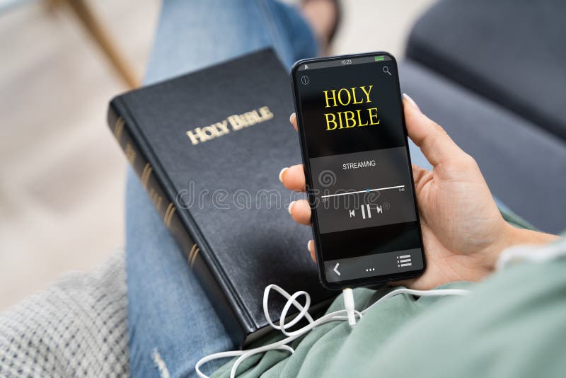 Woman Listening To Bible Audiobook On Smartphone. Woman Listening To Bible Audiobook On Smartphone