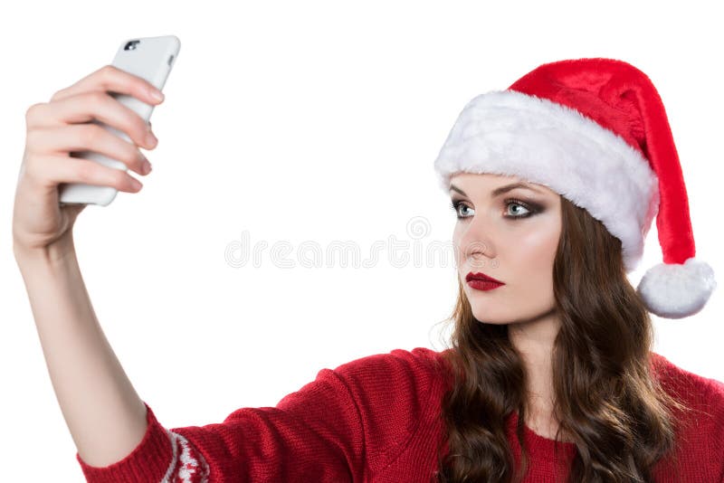 Kobieta w Santa kapeluszowym bierze selfie fotografia stock