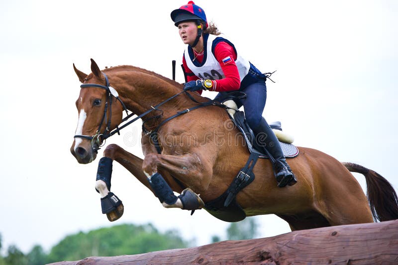 MOSCOW - JUNE 02: Unidentified rider on horse is overcomes the obstacle at the International Eventing Competition CCI3*/2*/1* Russian Cup Eventing June 02, 2012 in Moscow, Russia. MOSCOW - JUNE 02: Unidentified rider on horse is overcomes the obstacle at the International Eventing Competition CCI3*/2*/1* Russian Cup Eventing June 02, 2012 in Moscow, Russia