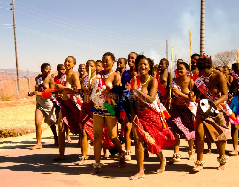 Women in traditional costumes marching at the Umhlanga aka Reed Dance ceremony - 01-09-2013 Lobamba, Swaziland. Women in traditional costumes marching at the Umhlanga aka Reed Dance ceremony - 01-09-2013 Lobamba, Swaziland