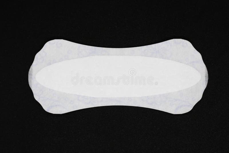 Kobiety ` s higieny produkty tampon i uszczelka zamknięci w górę czarnego tła na miejsce tekst zdjęcie royalty free Kobiety ` s higieny produkty tampon i uszczelka zamknięci w górę czarnego tła na miejsce tekst zdjęcie royalty free