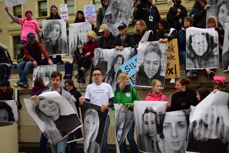 Women`s March in Washington DC: Protestors holding posters with women unable to attend the Women`s March. Women`s March in Washington DC: Protestors holding posters with women unable to attend the Women`s March