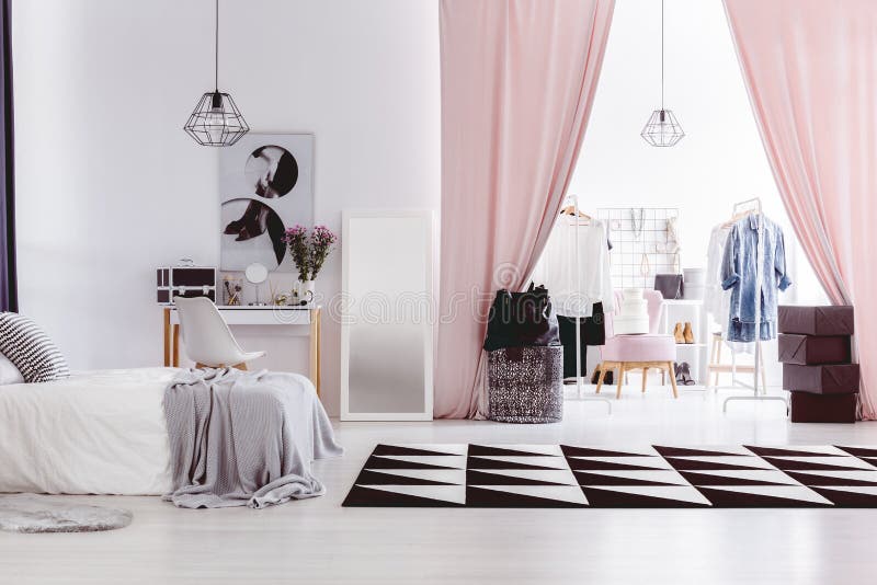 Black and white carpet in woman`s bedroom interior with walk-in closet next to dressing table. Black and white carpet in woman`s bedroom interior with walk-in closet next to dressing table