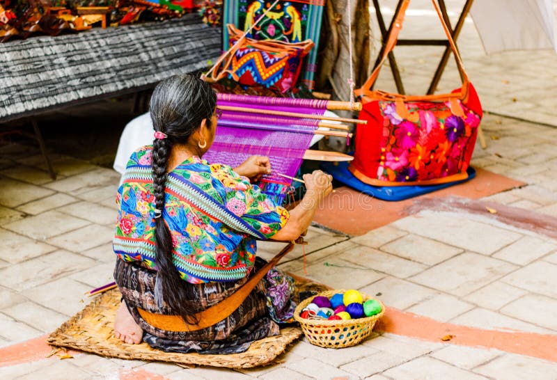 Woman weaving in an old village in Guatemala. Traditional waver from Guatemala. Woman weaving in an old village in Guatemala. Traditional waver from Guatemala.