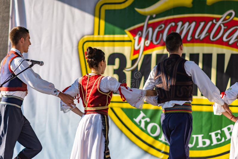 Young Men and Girls Dancing Serbian Traditional National Folk Dance