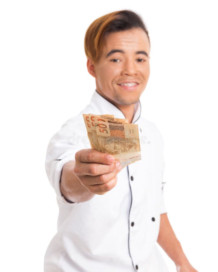 Kochen Sie tragende Arbeitsuniform und das Zeigen von Bargeldrechnungen stockfotos