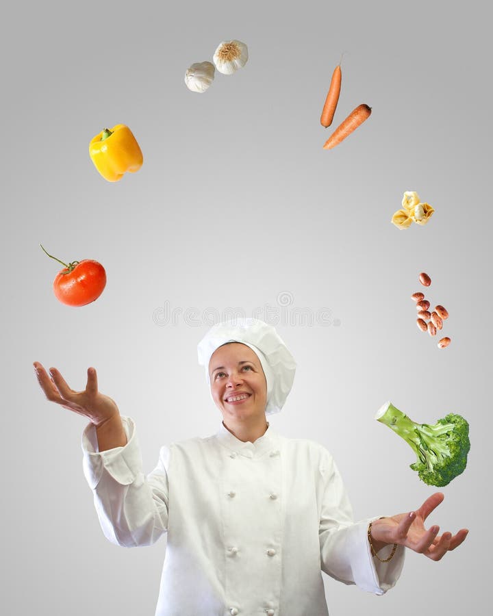 Woman cook juggler with vegetables and other food ingredients. Woman cook juggler with vegetables and other food ingredients