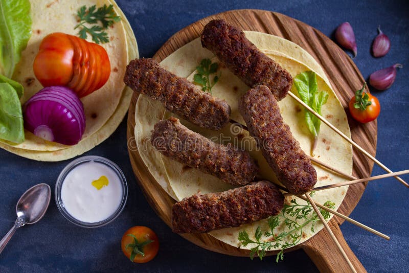Kofta Kebabs with Pita Bread, Vegetables and Yogurt Sauce. Stock Photo