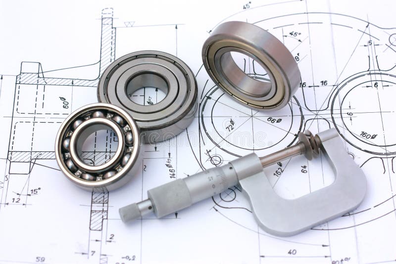 Kogellagers met micrometer op technische tekening royalty-vrije stock foto Kogellagers met micrometer op technische tekening royalty-vrije stock foto