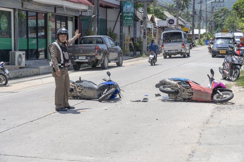 KOH PHANGAN, THAILAND - MAY 19, 2019 : Motorcycle accident that happened on the road at tropical island Koh Phangan, Thailand . Traffic accident between a motorcycle on street